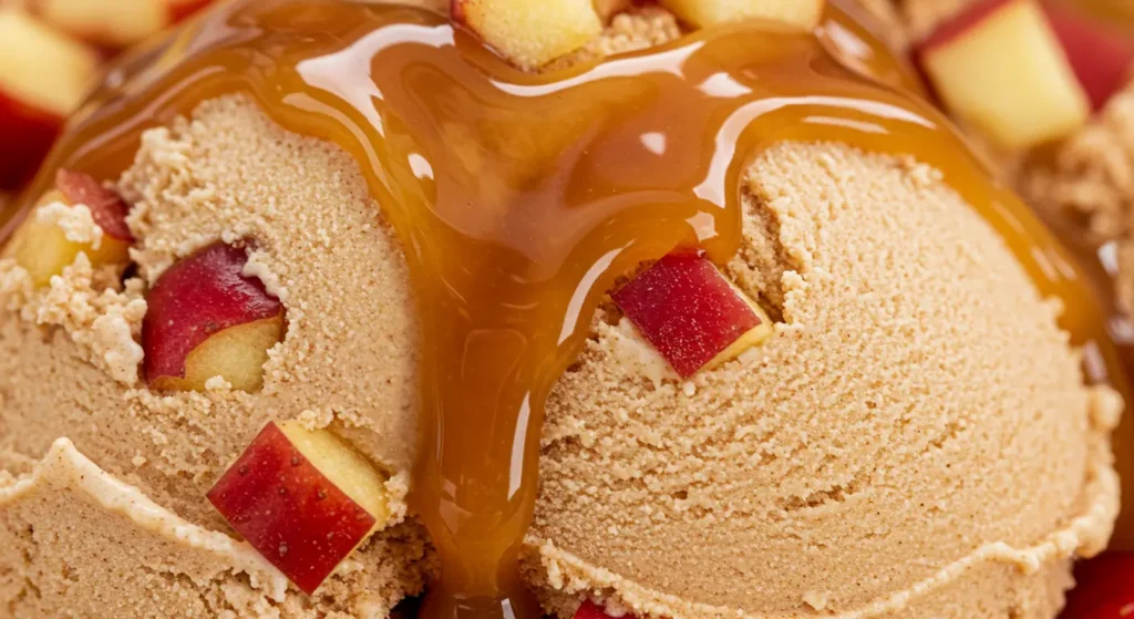 Healthy Ninja Creami Recipes: Cinnamon-spiced tan-colored scoop with apple pieces and a drizzle of caramel sauce